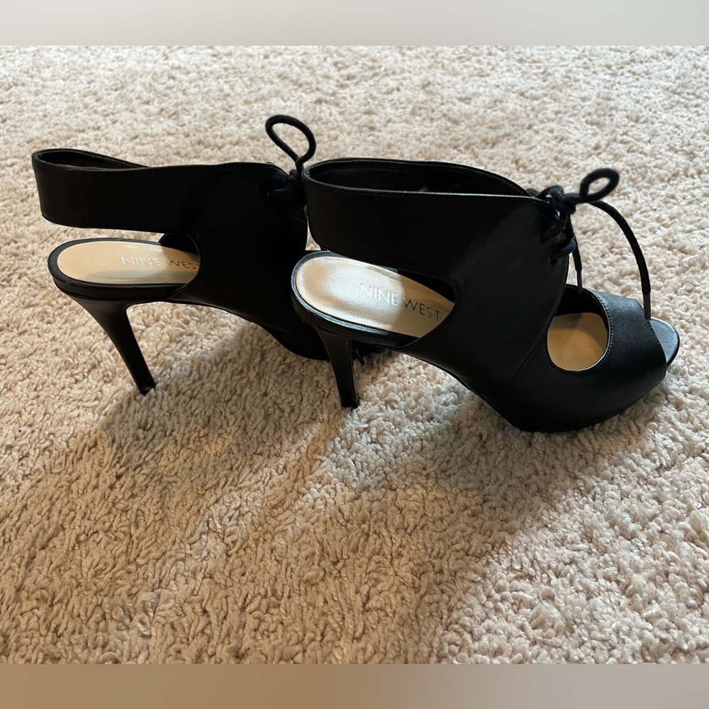 Nine West black leather lace-up heels, NWOT, never worn. Size 4.
